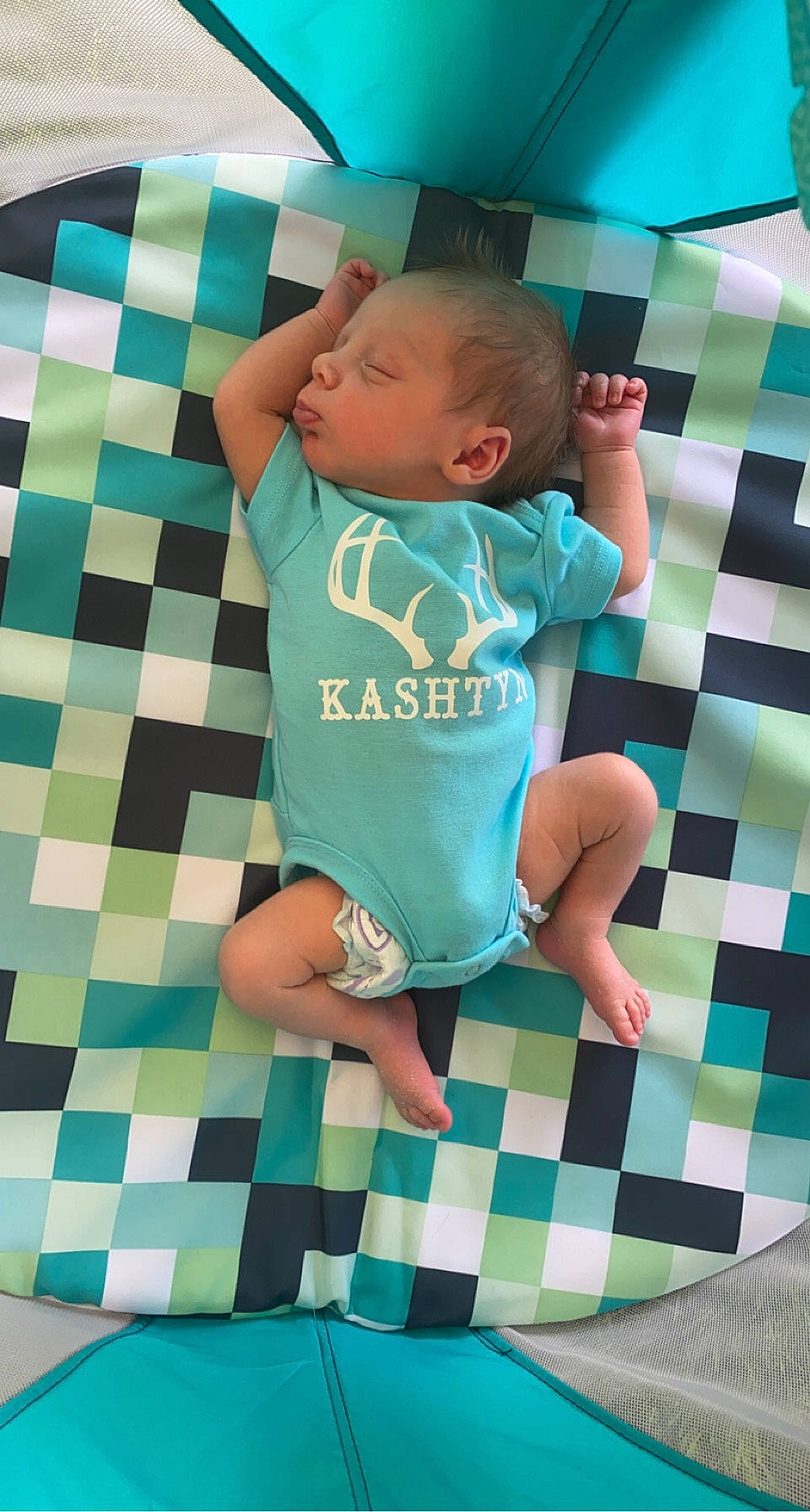 Kashtyn is registered to the contest to win money with this photo: aqua, azure, baby, baby_toddler_clothing, blue, comfort, finger, floor, green, hairstyle, hand, joint, person, photograph, product, sleeve, standing, textile, toddler, white