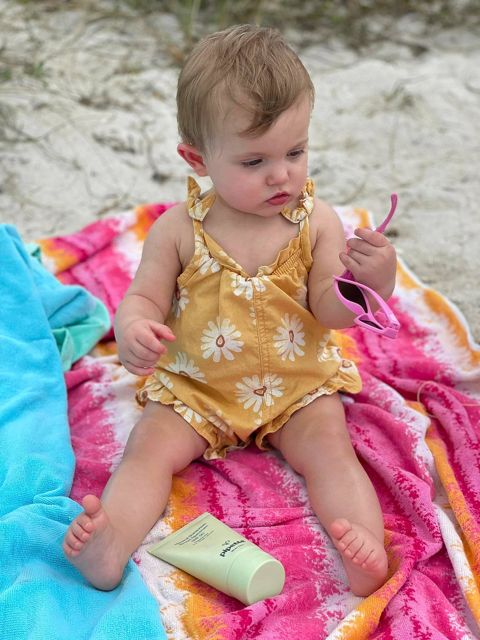 Haisley joined the competition — help win amazing prizes! baby, baby_toddler_clothing, child, embellishment, fun, grass, happy, leisure, magenta, pattern, people_in_nature, person, pink, play, recreation, sitting, skin, toddler, vacation