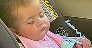Ahvi joined the competition — help win amazing prizes! baby, infant, sleeping, car_seat, vehicle, portrait, face, closed_eyes, peaceful, pink_clothing, blanket, toy, pacifier_toy, seatbelt, travel, indoor, automobile, child, resting, photography