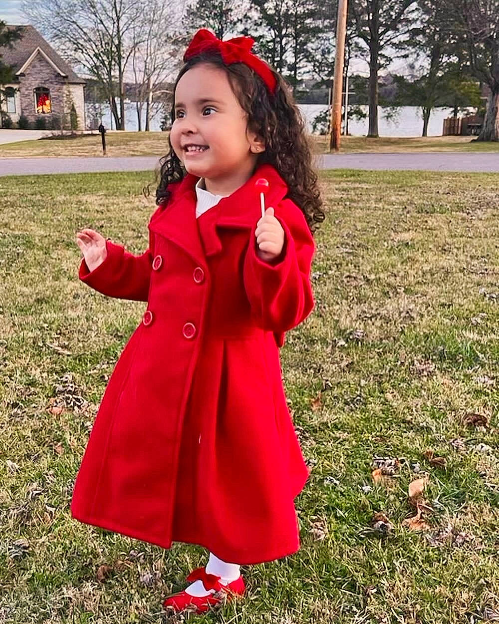 Reign is registered to the contest to win money with this photo: child, dress, fun, fur, grass, happy, jacket, joy, leisure, magenta, overcoat, pattern, people_in_nature, person, pink, plant, recreation, sleeve, smile, toddler