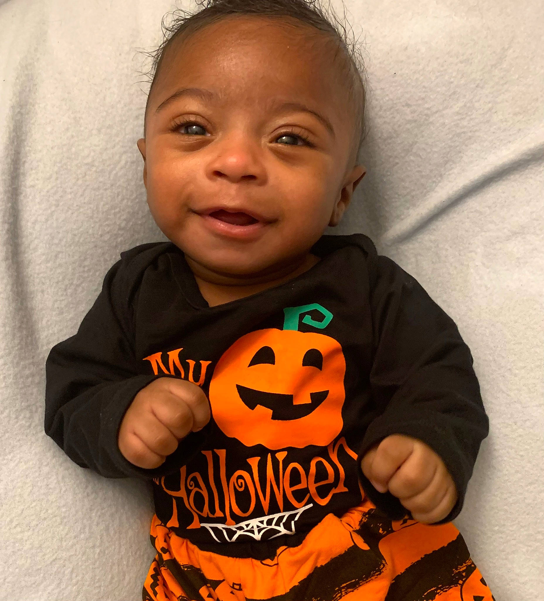 Romell is registered to the contest to win money with this photo: baby_toddler_clothing, calabaza, cheek, cool, cucurbita, eye, face, gourd, happy, head, mouth, nose, orange, person, plant, pumpkin, sleeve, smile, t_shirt, toddler