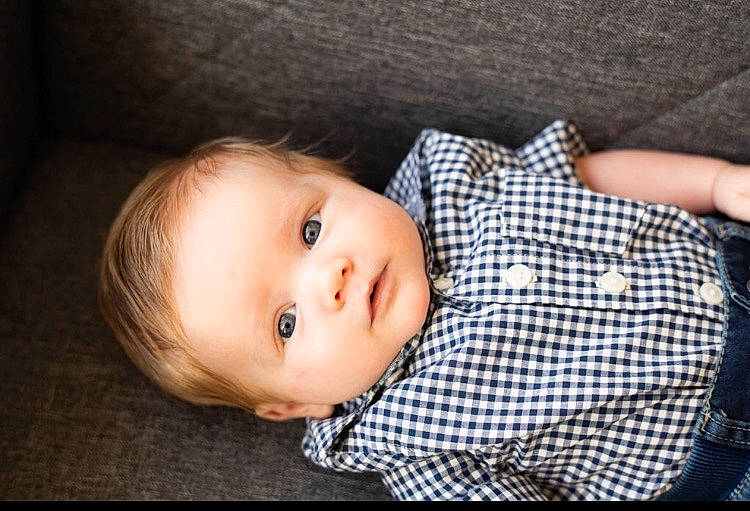 Raleigh is registered to the contest to win money with this photo: baby, cheek, child, child_model, design, ear, eye, face, head, iris, lip, nose, pattern, person, photography, plaid, portrait, portrait_photography, skin, toddler