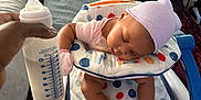 A'Jshanae joined the competition — help win amazing prizes! baby, baby_seat, bed, blanket, blue, bottle, cute, feeding, hand, hat, indoor, infant, milk, nursery, peaceful, pink, polka_dots, sleeping, socks, white