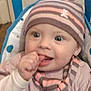 Clem a rejoint le concours — aidez-le/la à gagner de superbes lots ! baby, beanie, child, cozy, cute, face, hand_in_mouth, happy, hat, indoor, infant, person, polka_dot, portrait, scarf, seated, smiling, striped_clothing, warm_clothing, young_child