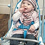 Clem a rejoint le concours — aidez-le/la à gagner de superbes lots ! baby, baby_seat, blue, child, clothing, cozy, cute, finger_in_mouth, floor, hand, happy, hat, indoor, infant, person, scarf, seated, smiling, striped_clothing, white