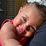 toddler, child, blue_eyes, curly_hair, flower_hair_clip, pink_clothing, close_up, face, smile, skin, arm, cuddling, affection, indoor, portrait, happy, cute, baby, person, head