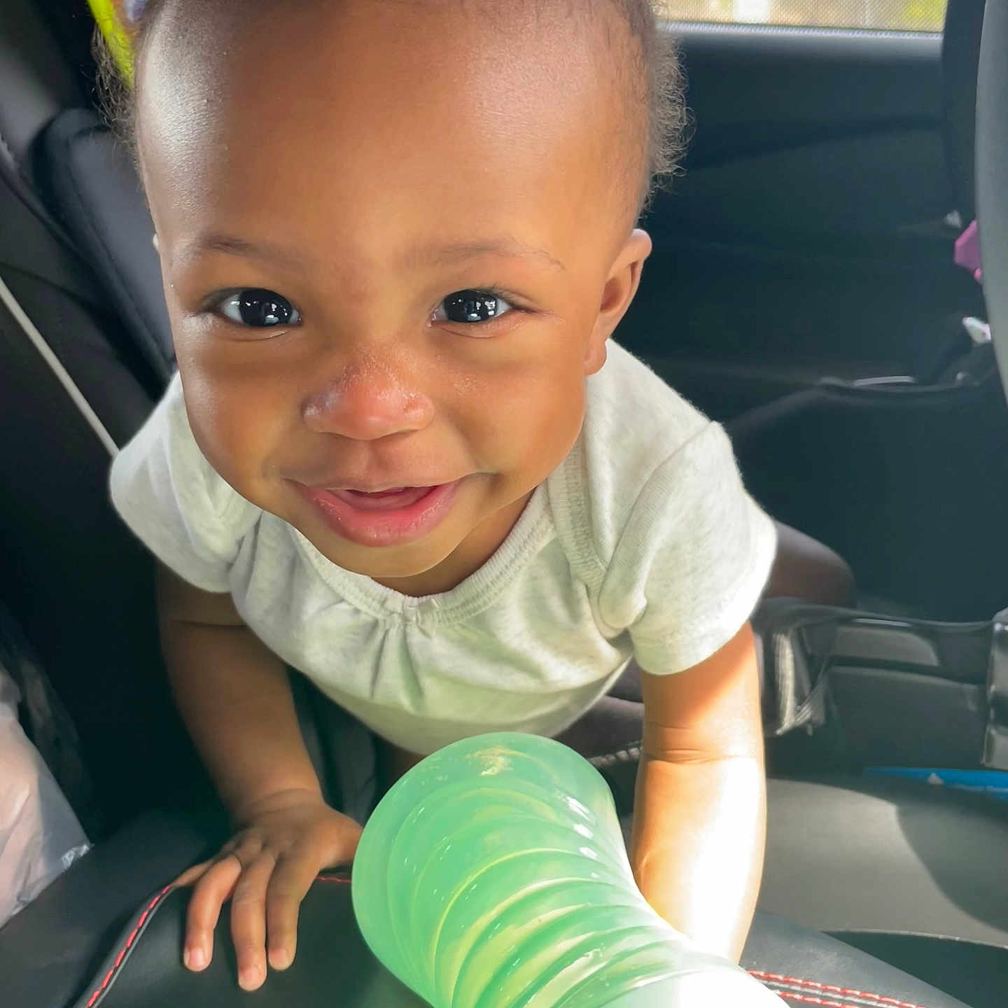Myia joined the competition — help win amazing prizes! accessories, baby, babylaughing, bodypart, clothing, cushion, face, happy, head, homedecor, jewelry, necklace, person, photography, portrait, sitting, smile, t_shirt, transportation, vehicle
