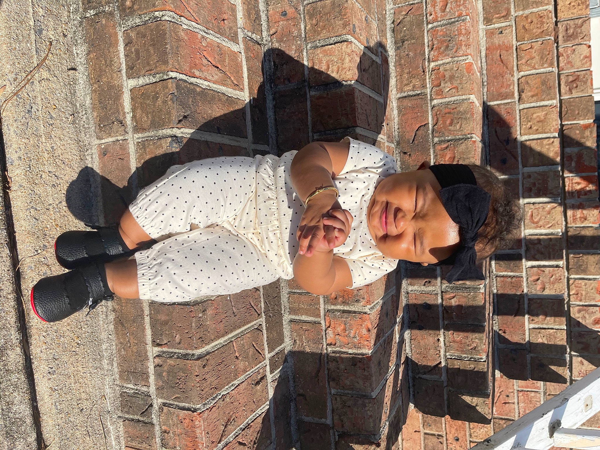 Kiyah joined the competition — help win amazing prizes! brick, brickwork, cobblestone, concrete, eyewear, facade, foot, headwear, human, human_leg, pattern, person, shadow, sitting, street_fashion, thigh, town, urban_area, visual_arts, waist