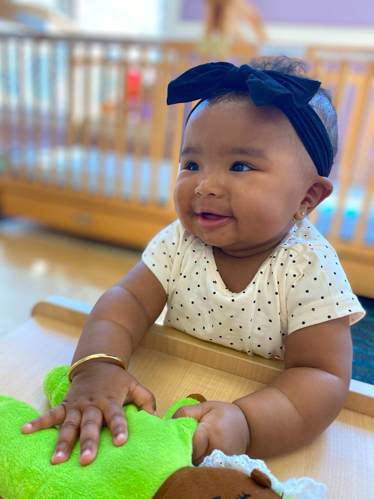 Kiyah is registered to the contest to win money with this photo: baby, baby_playing_with_toys, baby_toddler_clothing, blue, child, fashion_accessory, finger, flooring, fun, happy, leisure, nail, people, person, sitting, skin, sleeve, smile, thumb, toddler