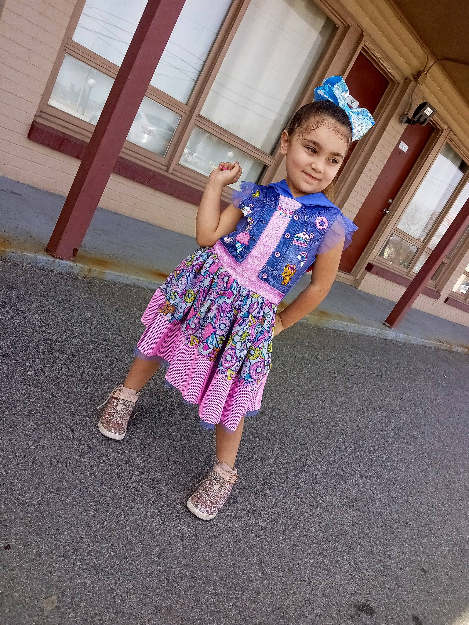 Jordynn is registered to the contest to win money with this photo: baby_toddler_clothing, dress, electric_blue, fashion_design, flooring, fun, happy, human_leg, joy, leg, leisure, magenta, pattern, person, sandal, shoe, sitting, street_fashion, tints_and_shades, toddler