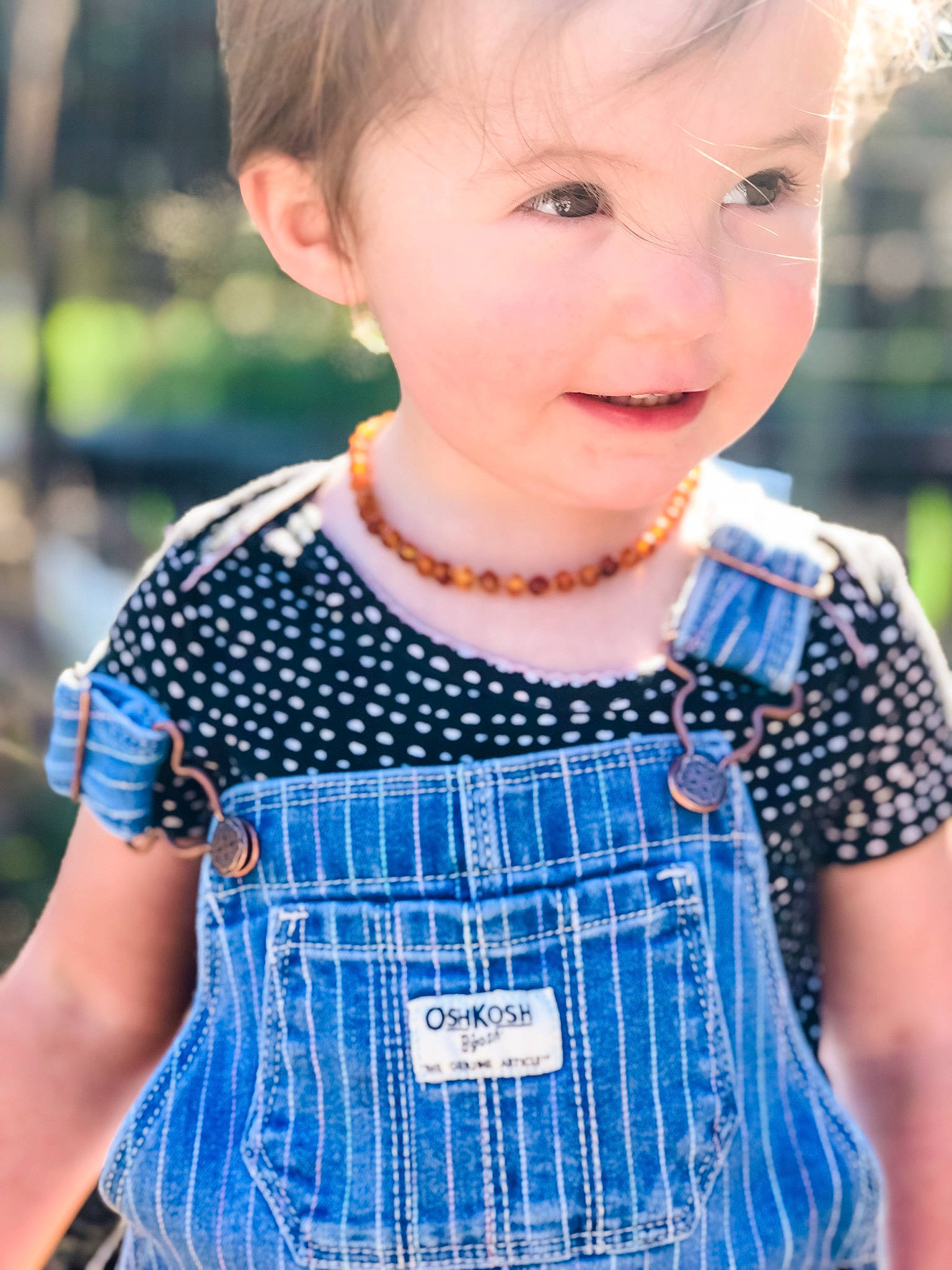 Emilyn joined the competition — help win amazing prizes! aqua, baby_toddler_clothing, blue, child, cool, facial_expression, fashion, grass, hairstyle, happy, iris, neck, one_piece_garment, person, photograph, plaid, shoulder, sleeve, standing, tartan