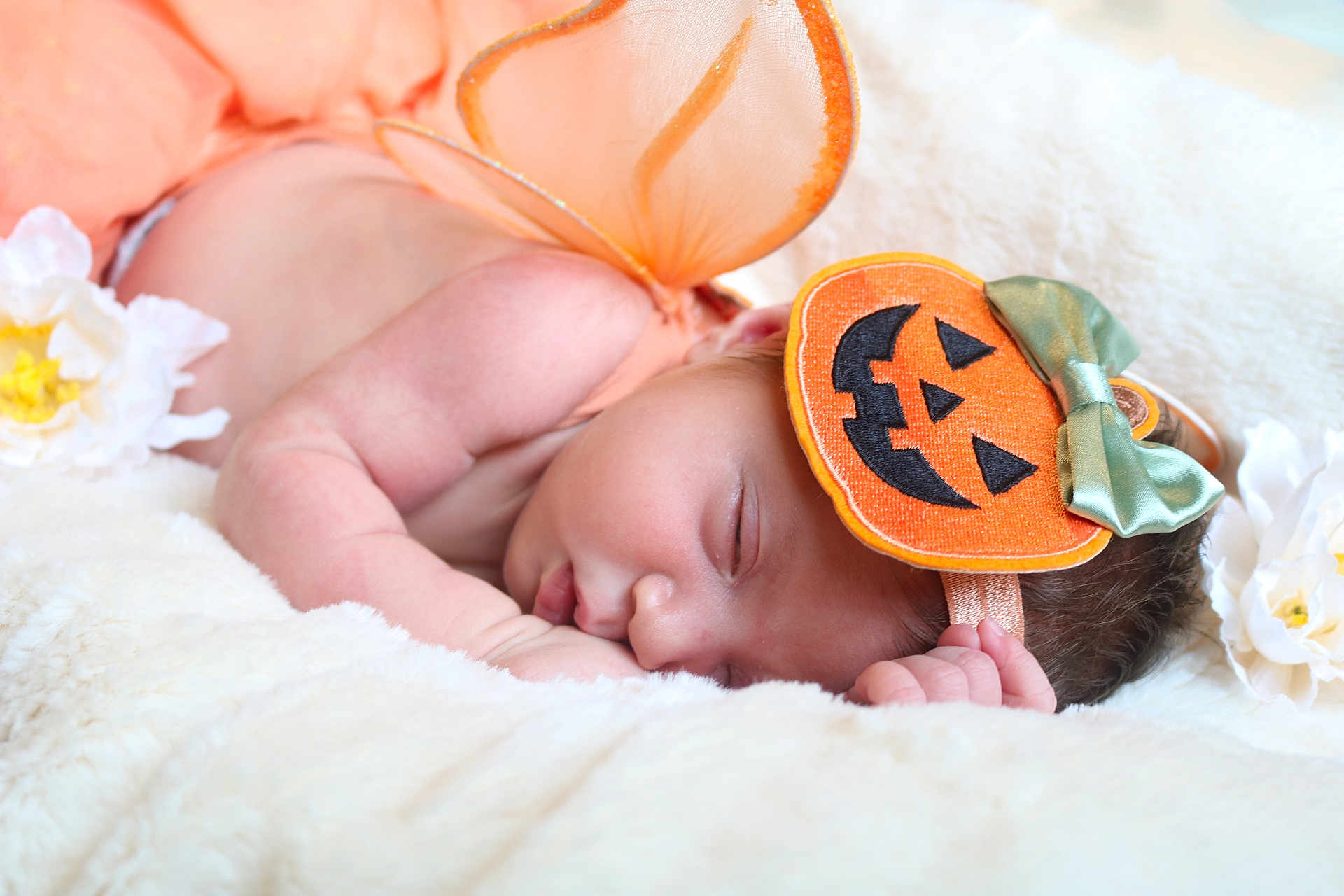 Aurora joined the competition — help win amazing prizes! baby, sleeping, infant, costume, halloween, pumpkin, headband, wings, orange, white_blanket, flower, cute, peaceful, newborn, soft, portrait, closeup, skin, resting, holiday
