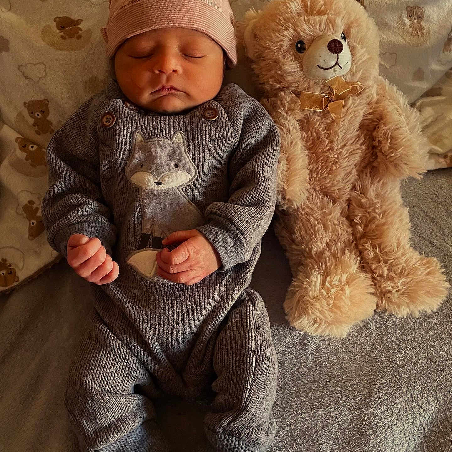 Dontez is registered to the contest to win money with this photo: baby, blanket, clothing, face, hat, head, newborn, person, sitting, sleeping, sleeve, teddybear, toy, yawning