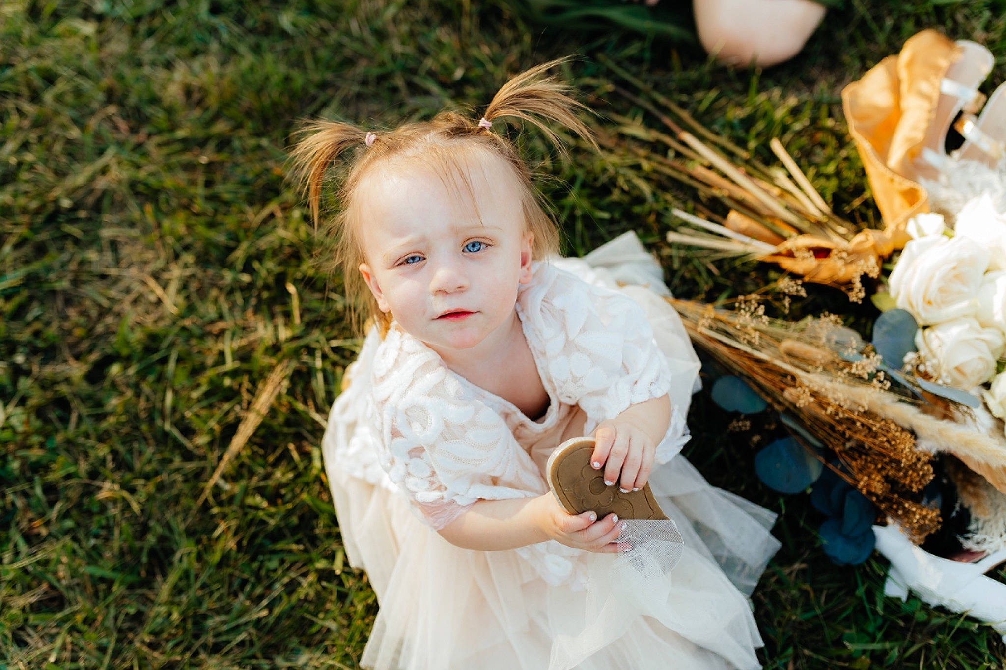 Everly joined the competition — help win amazing prizes! baby, bridal_accessory, bridal_clothing, child, dress, event, flash_photography, fun, gown, grass, happy, headpiece, people_in_nature, person, petal, plant, sitting, toddler, tradition, veil