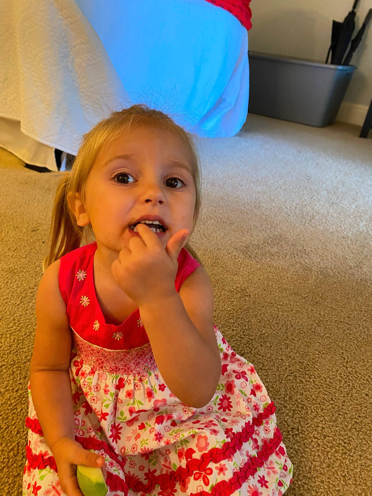 Elyza is registered to the contest to win money with this photo: baby, baby_toddler_clothing, blond, child, comfort, couch, dress, face, facial_expression, finger, flooring, fun, hairstyle, hand, happy, person, pink, sitting, smile, standing