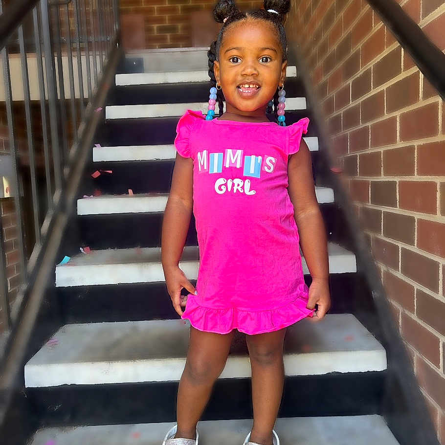 Nariyah is registered to the contest to win money with this photo: architecture, building, child, clothing, dress, face, female, footwear, girl, handrail, head, house, housing, person, photography, portrait, shoe, shorts, sleeve, staircase