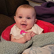 Addison is registered to the contest to win money with this photo: baby, smiling, blanket, cushion, indoor, happy, child, infant, seated, clothing, face, head, comfort, soft, portrait, closeup, cute, young, warm, cozy