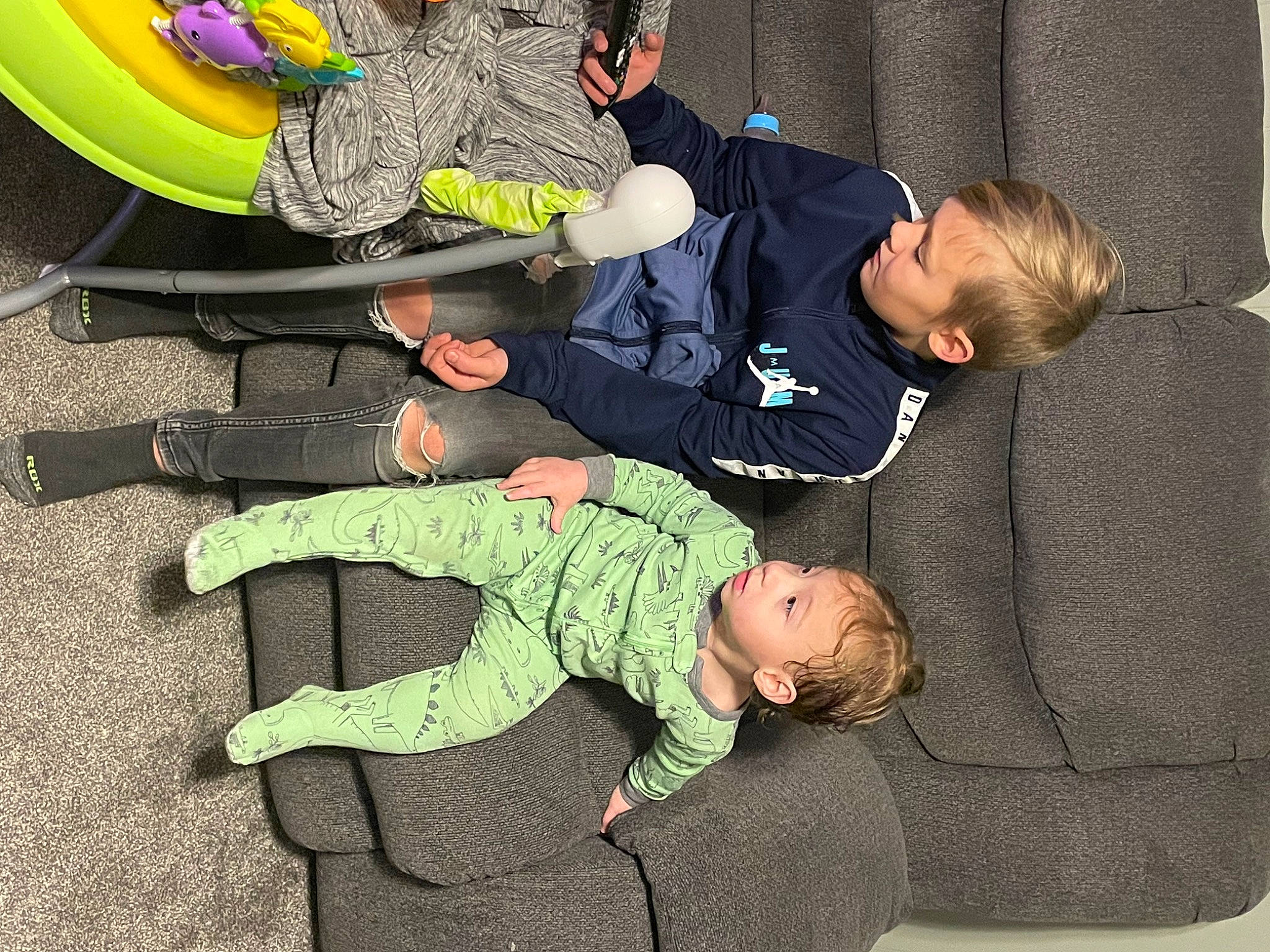 Thiago is registered to the contest to win money with this photo: baby, baby_toddler_clothing, camouflage, cargo_pants, child, comfort, crawling, flooring, fun, grass, green, knee, military_camouflage, outdoor_shoe, person, shoe, sitting, sleeve, sock, t_shirt