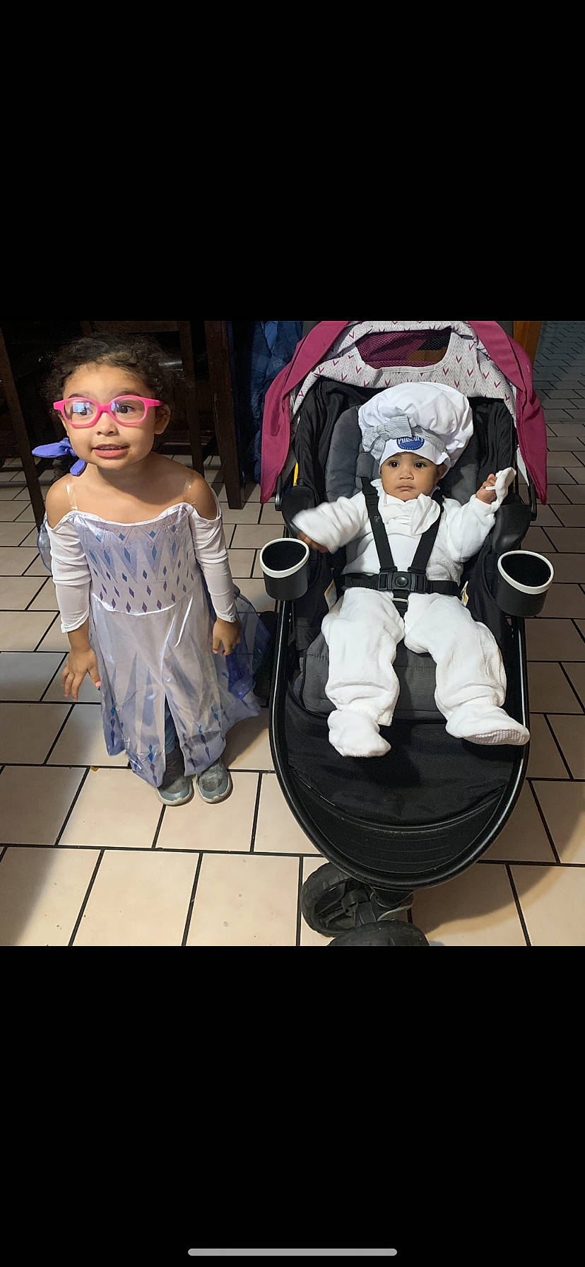 Annika is registered to the contest to win money with this photo: animation, baby, baby_products, child, costume, event, eyewear, fashion_design, flooring, fun, happy, headwear, leisure, performing_arts, person, photo_caption, recreation, sitting, sleeve, toddler
