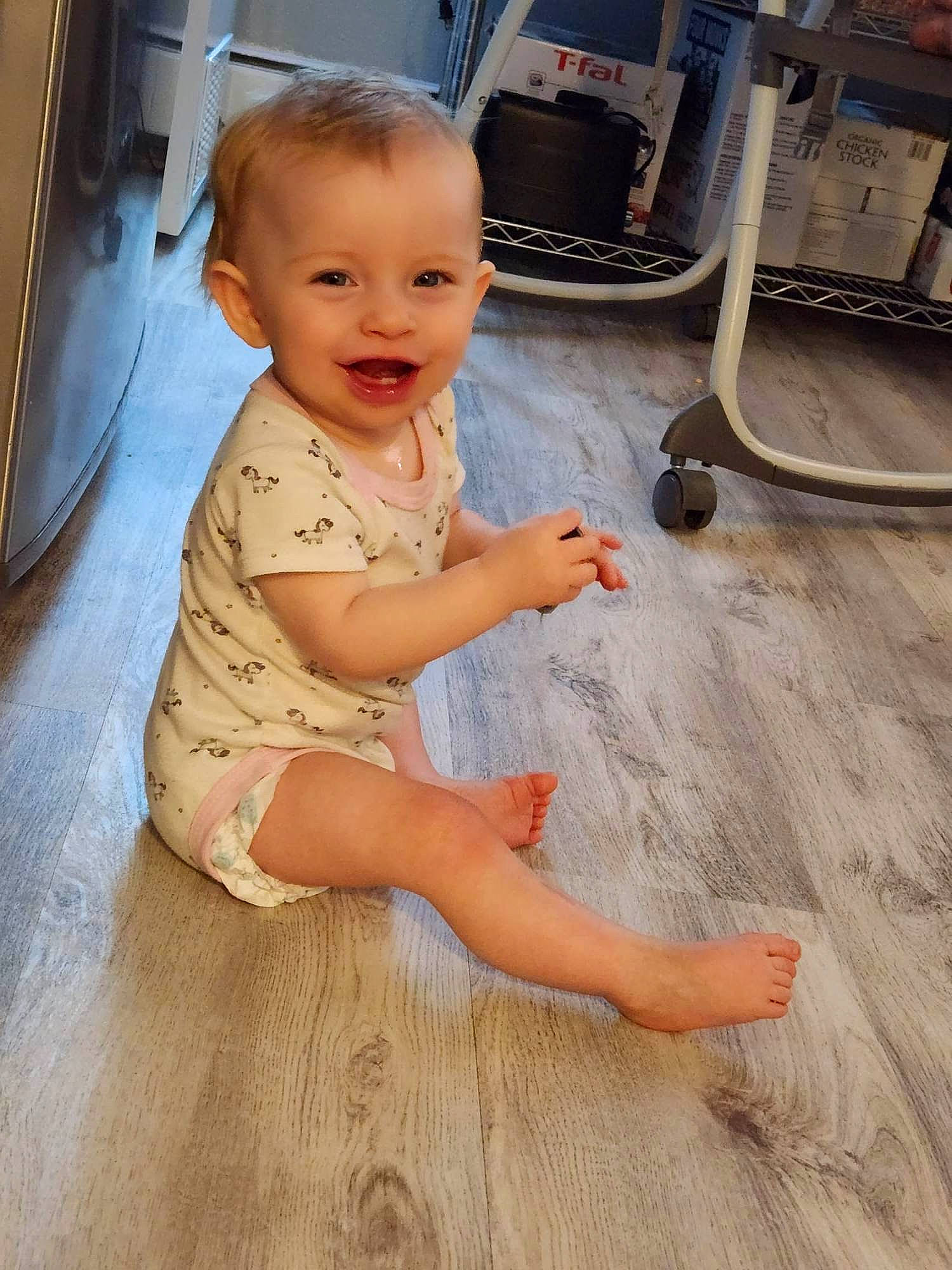 Gracelynn is registered to the contest to win money with this photo: baby, baby_toddler_clothing, barefoot, child, finger, floor, flooring, foot, gas, hand, hardwood, human_leg, joy, leg, person, skin, smile, standing, thigh, thumb