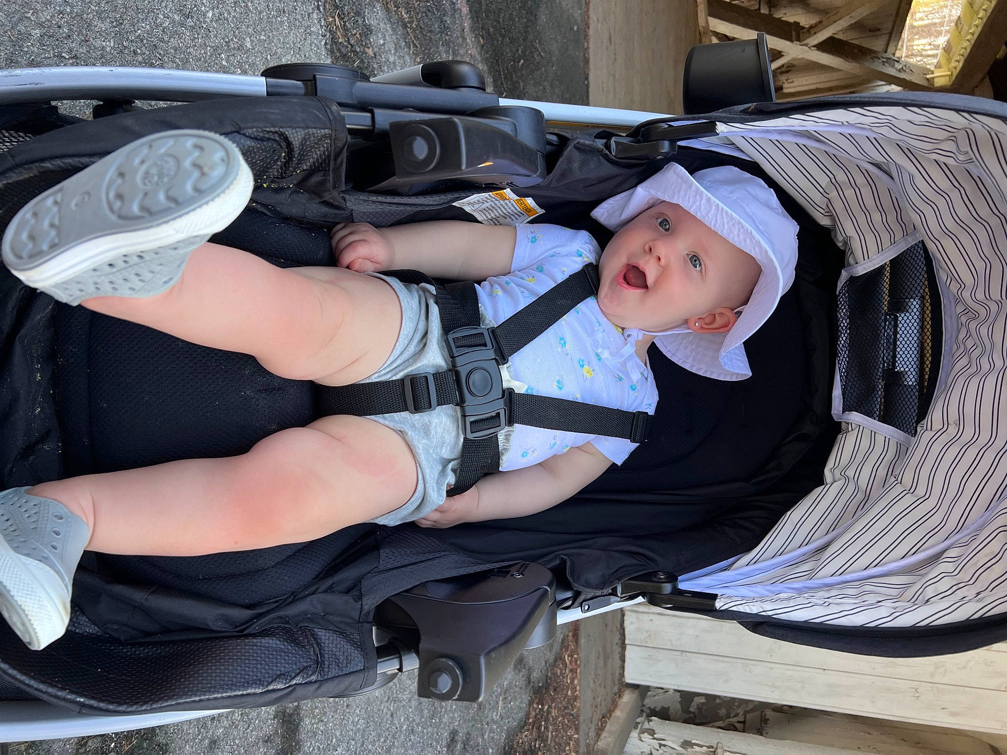 Kensley joined the competition — help win amazing prizes! automotive_exterior, baby_carriage, baby_products, baby_toddler_clothing, bag, bumper, comfort, hat, headgear, headwear, hood, human_leg, lap, leg, person, personal_protective_equipment, shoe, sneakers, sports_gear, surprise