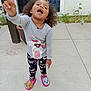 Myrtlelee joined the competition — help win amazing prizes! casual_clothing, child, concrete, curly_hair, daylight, footwear, girl, happy, outdoor, pajamas, person, plants, playful, pointing, pose, slippers, smiling, tiara, unicorn, window