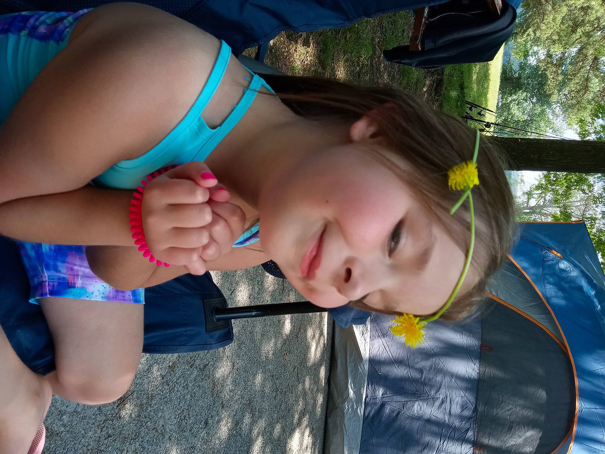 Jaklyn is registered to the contest to win money with this photo: black_hair, blue, child, cool, elbow, electric_blue, eyelash, eyewear, fashion_accessory, fun, grass, happy, human_leg, joy, knee, leisure, long_hair, mouth, person, thigh