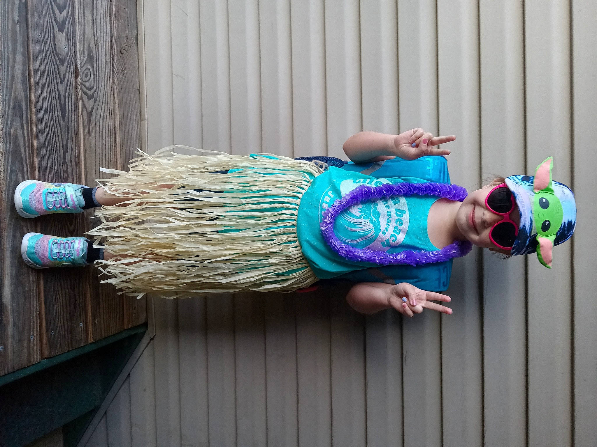 Jaklyn is registered to the contest to win money with this photo: blue, electric_blue, fashion_accessory, fashion_design, happy, headwear, human_leg, joy, magenta, pattern, person, pink, purple, smile, sunglasses, waist, wood, wrist