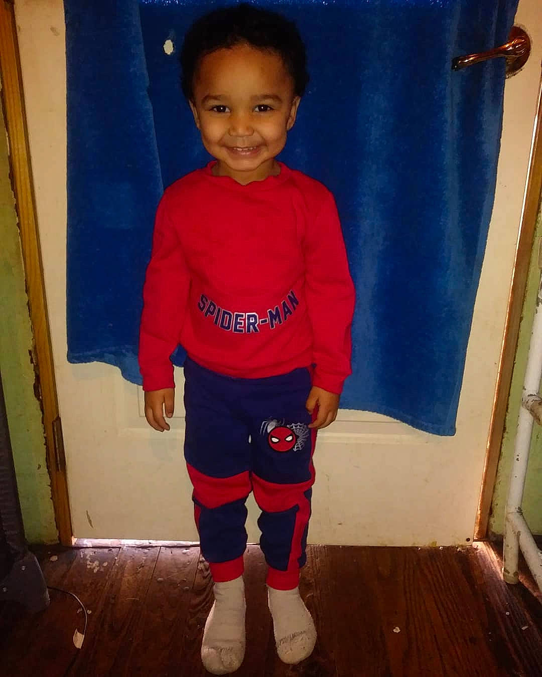 Alexander is registered to the contest to win money with this photo: arm, blue, boy, child, clothing, cool, costume, day, electric_blue, footwear, jeans, joy, outerwear, person, product, red, shoulder, sleeve, standing, t_shirt