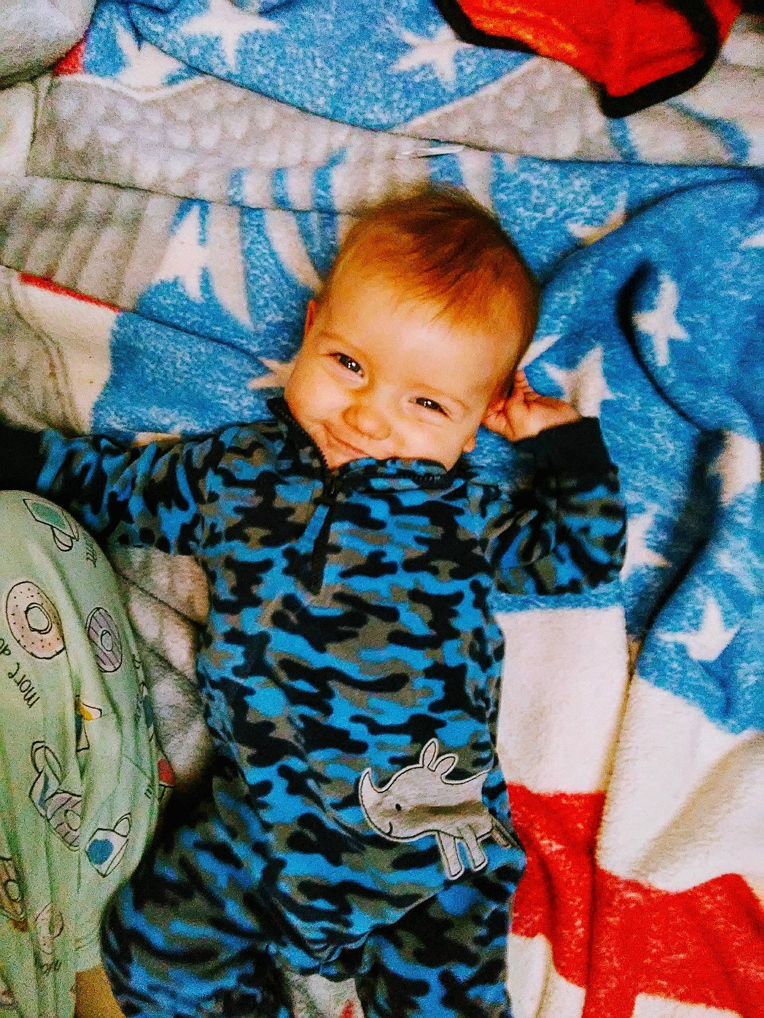Timothy is registered to the contest to win money with this photo: baby, blanket, cheek, child, joy, linens, person, skin, sleep, smile, textile, toddler