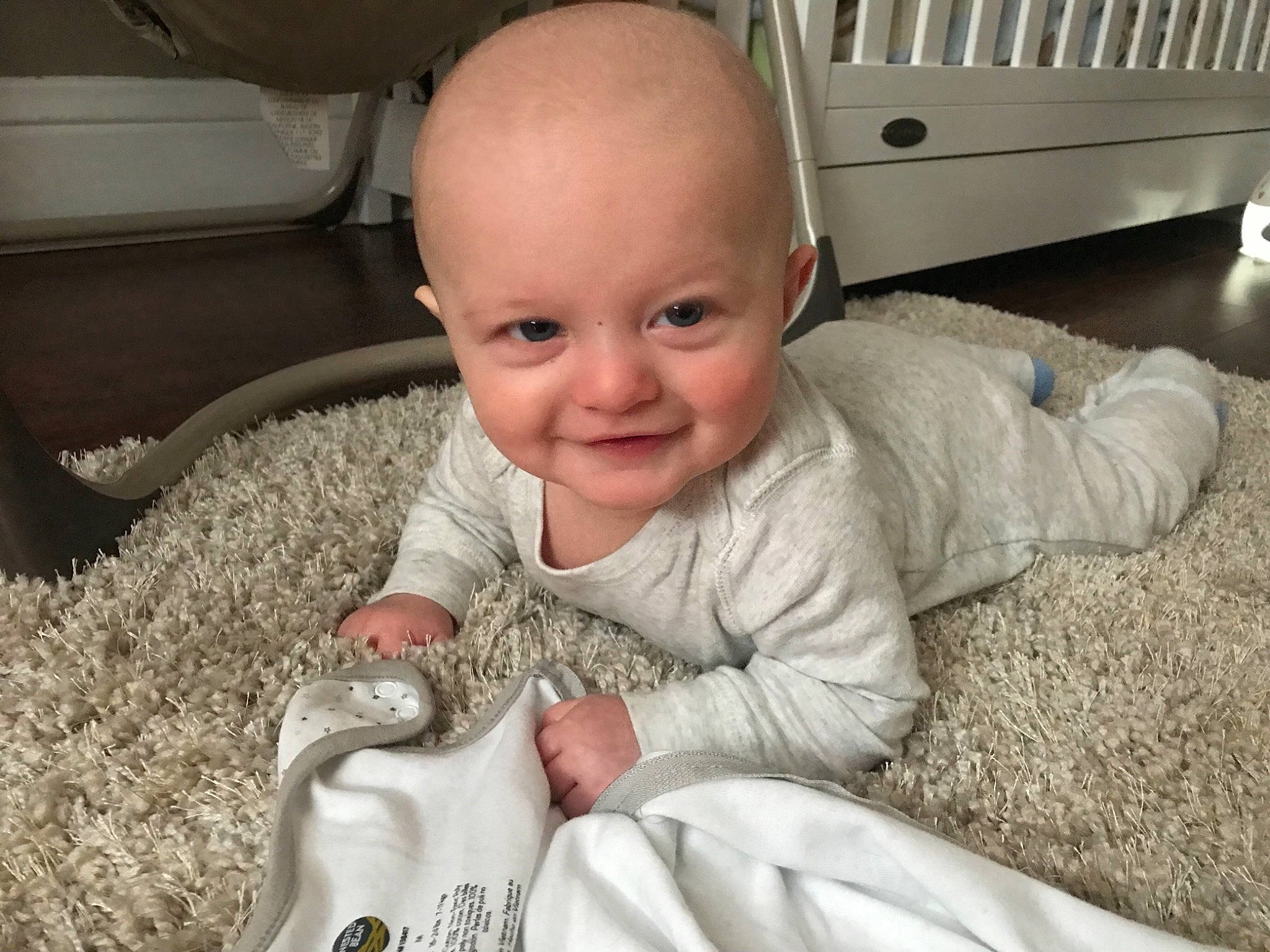 Brian is registered to the contest to win money with this photo: baby, cheek, child, electronic_device, eye, face, facial_expression, finger, hand, happy, head, joy, nose, people, person, play, sitting, skin, smile, thumb