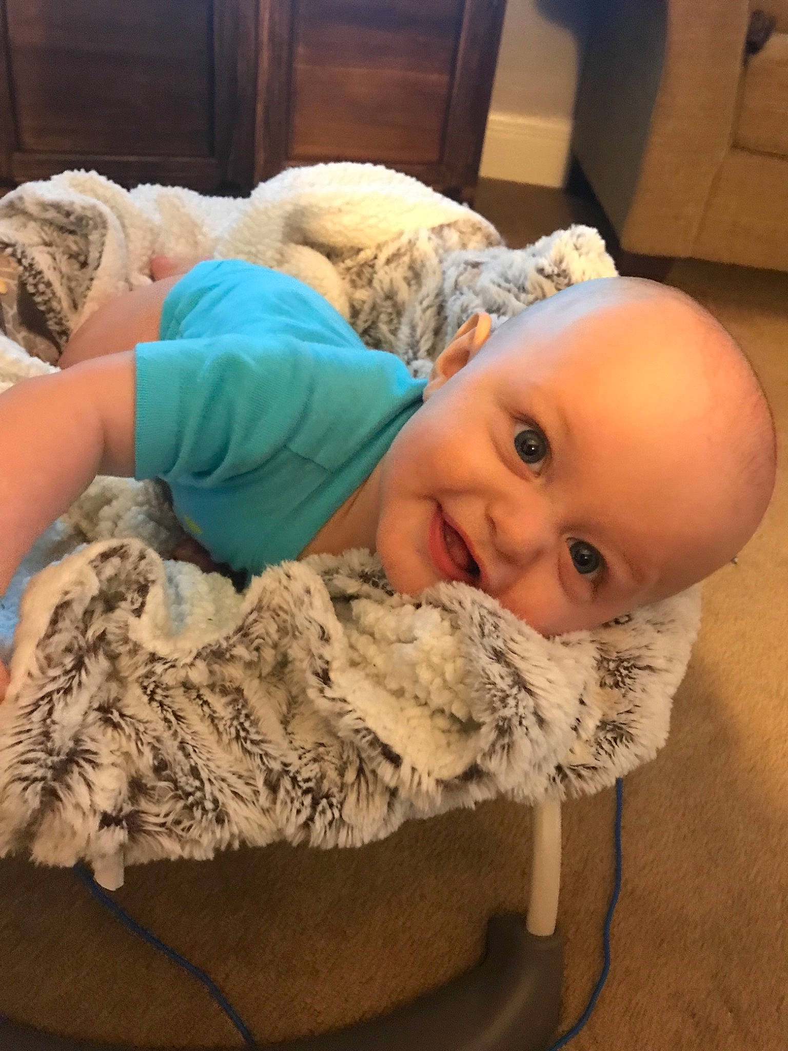 Brian is registered to the contest to win money with this photo: baby, birth, cheek, child, joy, person, skin, smile, textile, toddler, wool