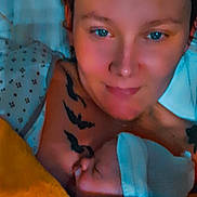 Liam participe au concours pour gagner de l'argent avec cette photo : adult, baby, sleeping, blanket, tattoo, face, person, closeup, indoors, bed, resting, skin, headwear, comfort, candid, warmth, family, love, parent, newborn