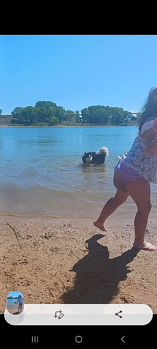 Galaxy is registered to the contest to win money with this photo: azure, beach, blue, coastal_and_oceanic_landforms, fun, horizon, human_leg, lake, landscape, leisure, people_on_beach, sand, shore, shorts, sky, thigh, travel, tree, water, wind_wave