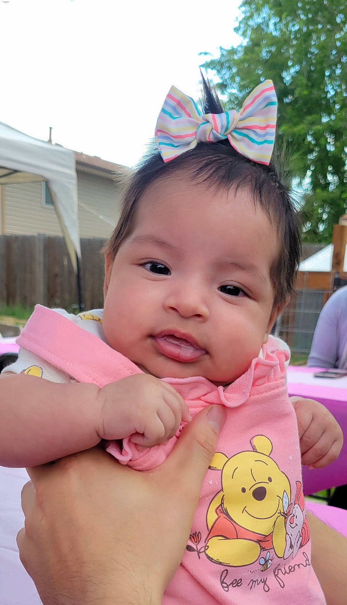 Annalise joined the competition — help win amazing prizes! baby, baby_toddler_clothing, cheek, chin, facial_expression, fun, gesture, grass, hairstyle, happy, human, leisure, party_hat, person, pink, plant, skin, sleeve, smile, toddler