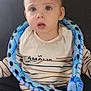 Raol a rejoint le concours — aidez-le/la à gagner de superbes lots ! blue_pants, camo_pants, casual, child, clothing, couch, curious, expression, face, indoor, person, plush_toy, portrait, sitting, snake_toy, soft_toy, striped_shirt, toddler, toy, young_child