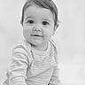 baby, child, infant, face, portrait, smile, curious, onesie, striped_clothing, hand, cute, black_and_white, monochrome, young, innocence, soft_light, close_up, sitting, person, expression