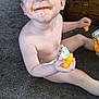 Caden joined the competition — help win amazing prizes! carpet, cheese_puffs, child, cute, diaper, expression, face, food, hair, hand, happy, indoor, messy, orange, sitting, skin, small_person, smiling, snack, toddler