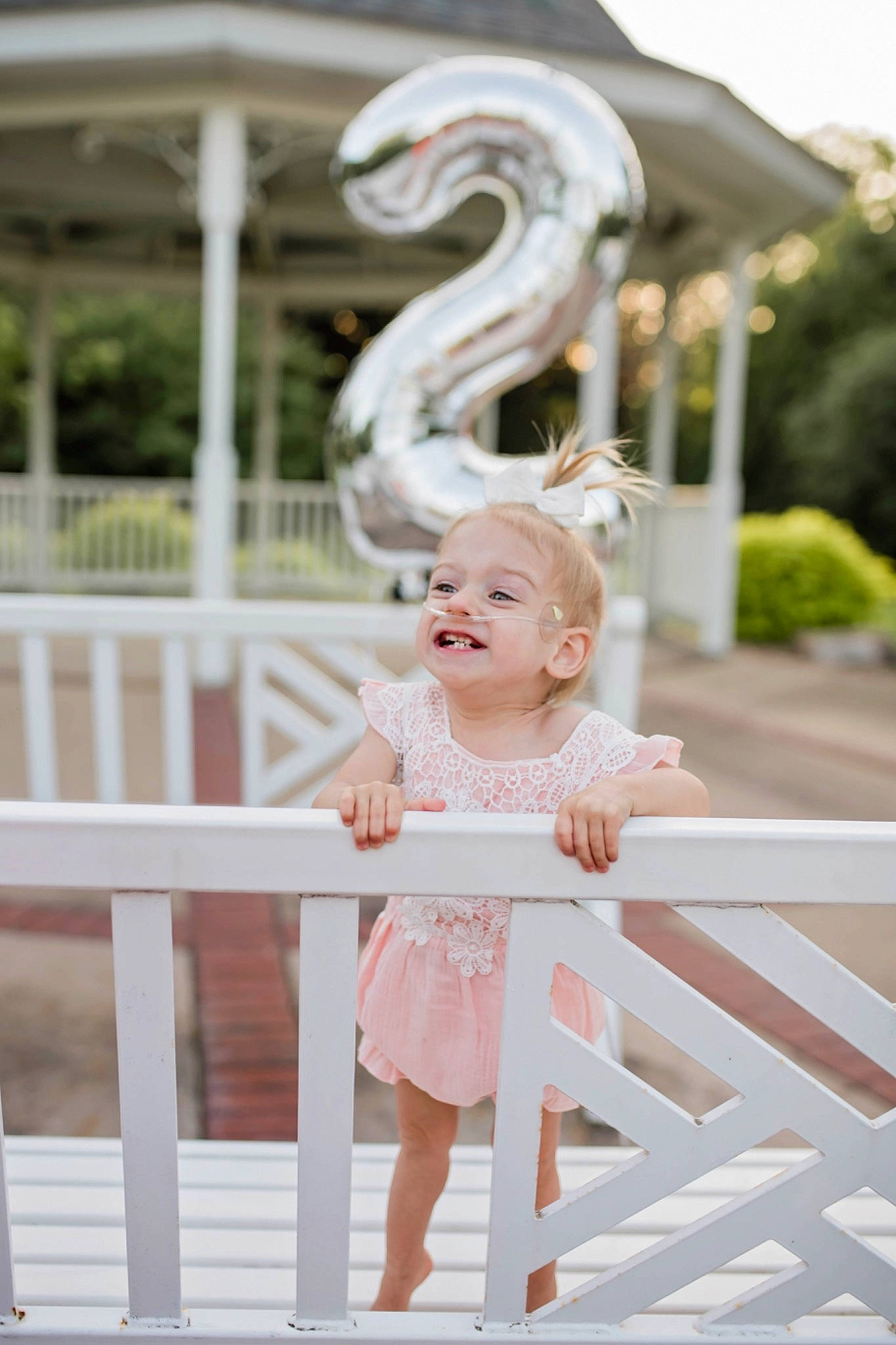 Sawyer is registered to the contest to win money with this photo: baby, baby_toddler_clothing, beauty, dress, face, fashion, fun, hairstyle, happy, joy, leisure, person, photograph, pink, plant, product, sleeve, snapshot, standing, summer