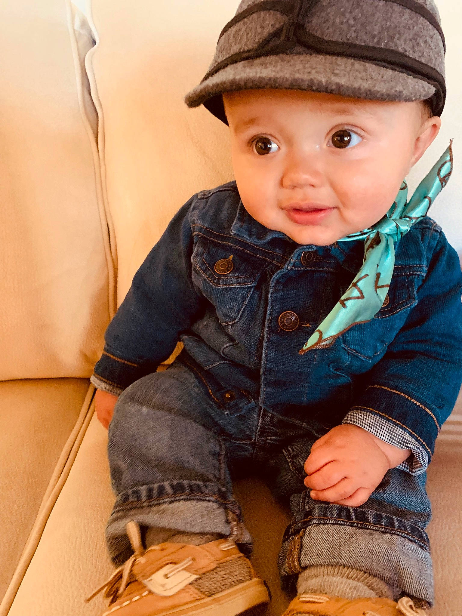 Tripp joined the competition — help win amazing prizes! baby, baby_toddler_clothing, cap, cheek, child, clothing, denim, facial_expression, flooring, hat, headgear, headwear, lip, nose, outerwear, pattern, person, sitting, skin, sleeve