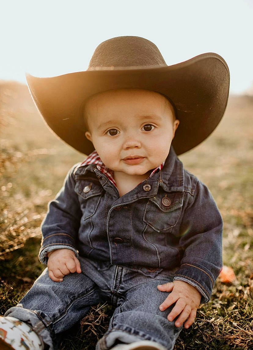 Tripp is registered to the contest to win money with this photo: baby_toddler_clothing, beauty, clothing, cowboy_hat, eye, flash_photography, grass, grassland, happy, hat, headgear, iris, landscape, mammal, people_in_nature, person, plant, skin, sun_hat, toddler