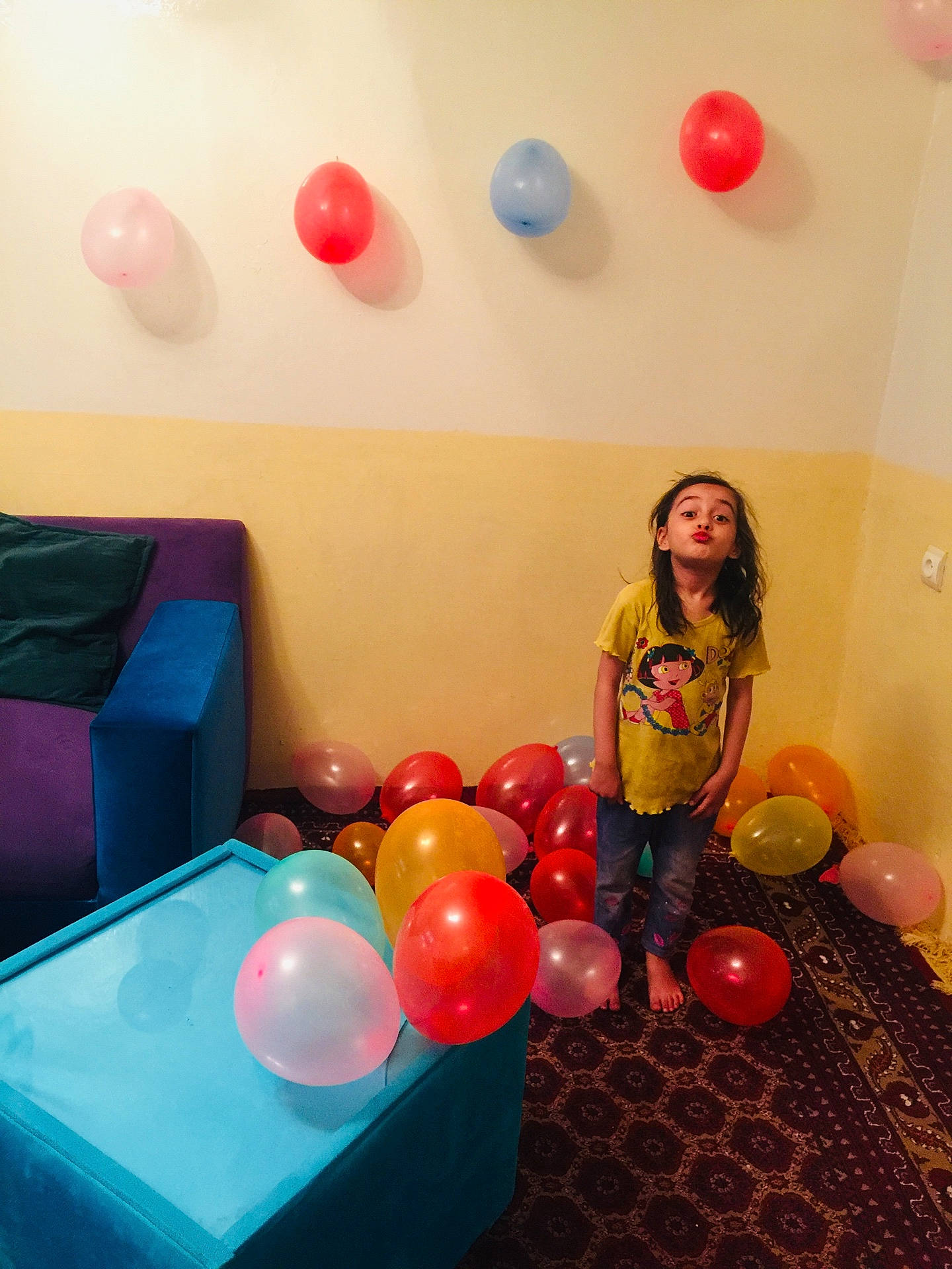 Rahwa is registered to the contest to win money with this photo: architecture, balloon, box, building, child, couch, face, female, furniture, girl, head, indoors, inflatable, livingroom, people, person, photography, portrait, room, sphere