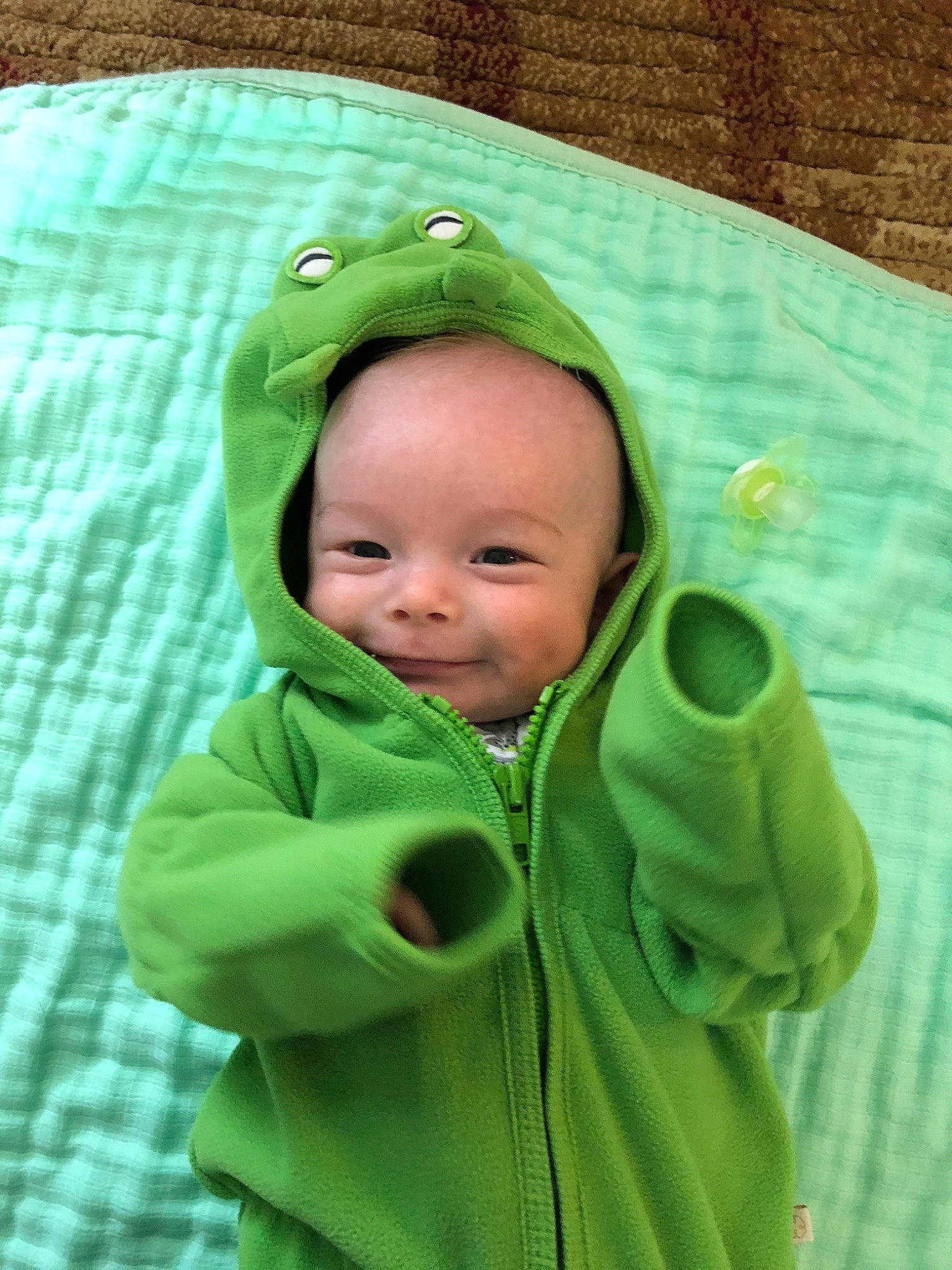 Finnegan is registered to the contest to win money with this photo: baby, child, green, hoodie, joy, outerwear, person, toddler
