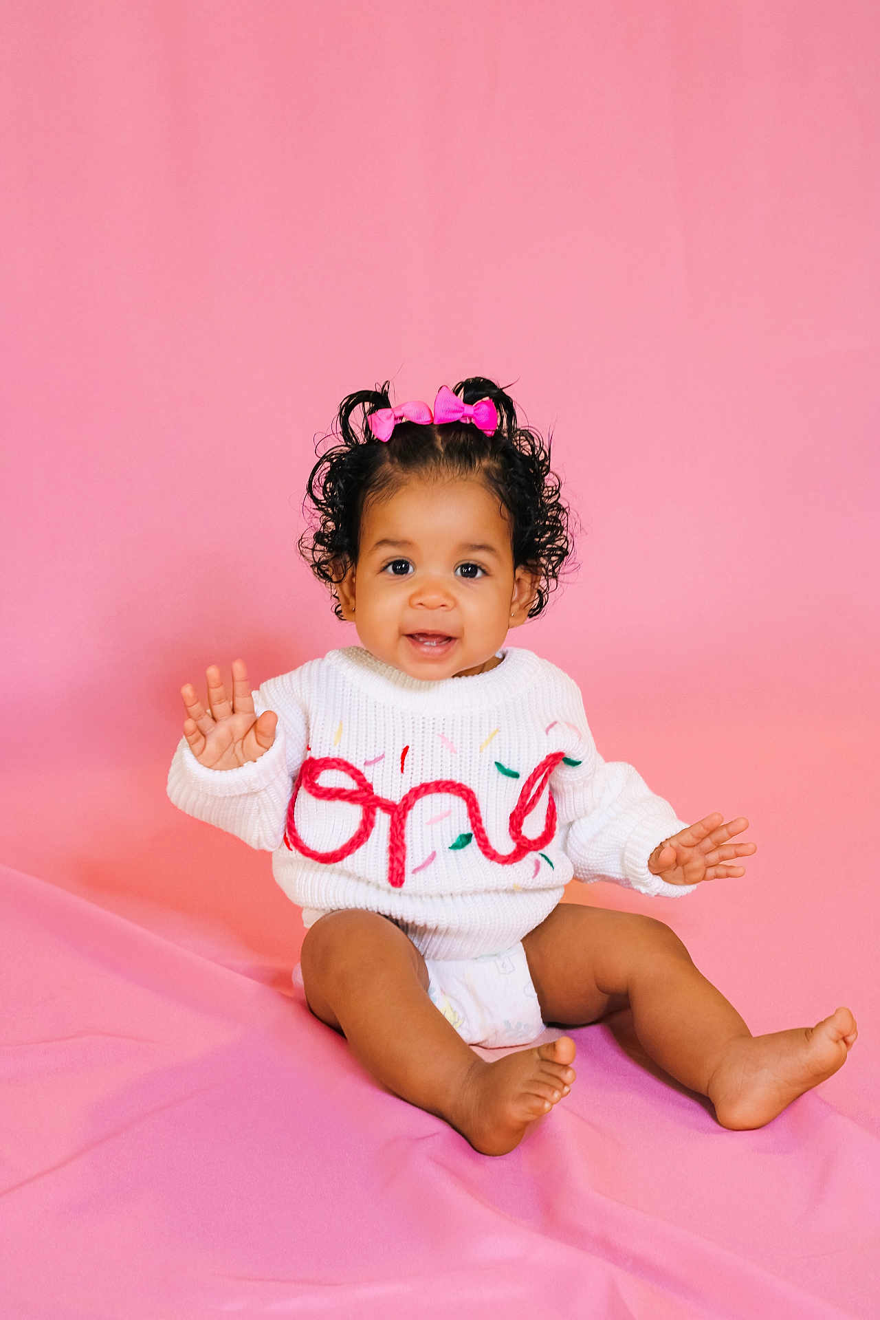 Lilliana Grace is registered to the contest to win money with this photo: applique, baby, babylaughing, bodypart, clothing, diaper, dress, face, finger, hand, happy, head, newborn, pattern, person, photography, portrait, sitting, smile, t_shirt