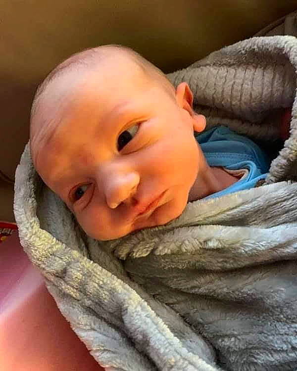 Silas joined the competition — help win amazing prizes! baby, baby_toddler_clothing, cheek, child, close_up, comfort, eye, eyebrow, eyelash, fur, happy, iris, linens, nose, person, sitting, skin, sleeve, smile, toddler