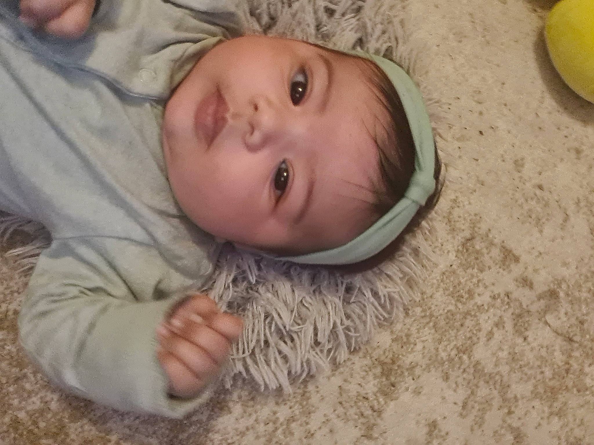 Lyana participe au concours pour gagner de l'argent avec cette photo : baby, baby_toddler_clothing, cheek, comfort, eye, eyebrow, face, flooring, fun, grass, hair, head, headwear, iris, nose, person, skin, sleeve, smile, toddler