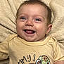 baby, babylaughing, bodypart, clothing, face, finger, hand, happy, head, laughing, mouth, newborn, person, photography, portrait, quilt, shirt, smile, t_shirt, teeth