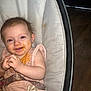 baby, bed, bodypart, chair, clothing, couch, crib, cutlery, dress, face, finger, furniture, hand, happy, head, infantbed, person, photography, portrait, spoon