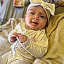 baby, blanket, bodypart, bonnet, cap, clothing, face, finger, hand, happy, hat, head, newborn, people, person, photography, portrait, quilt, smile, towel
