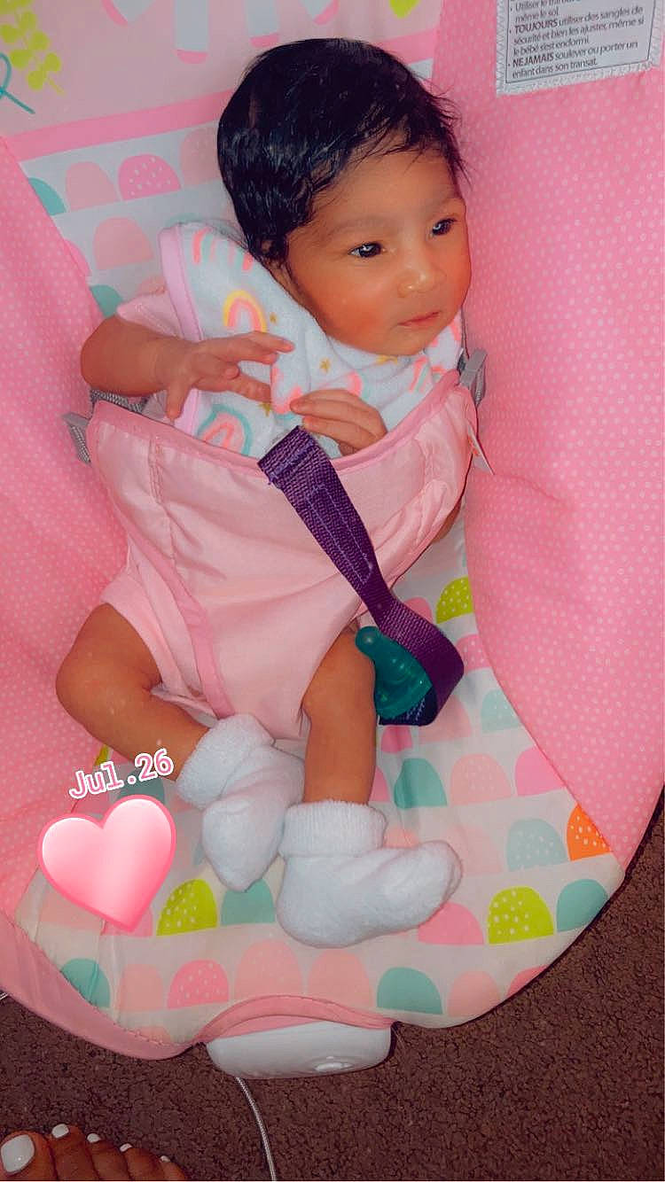 Adriana is registered to the contest to win money with this photo: baby, baby_products, baby_toddler_clothing, cheek, child, comfort, event, eyelash, hand, happy, magenta, pattern, person, pink, sitting, skin, sleeve, textile, thumb, toddler